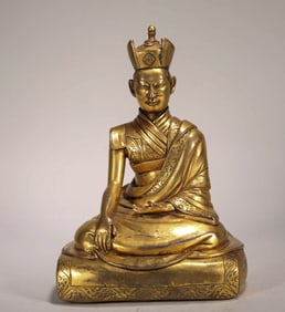 A QING DYNASTY GILDED BRONZE STATUE OF A GURU