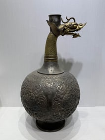 A TANG DYNASTY GILT DRAGON-HEADED VASE