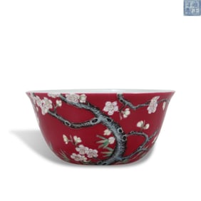 Qing Dynasty Yongzheng period Enameled porcelain wine cup with plum and bamboo motifs on a carmine