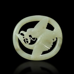 Jin Dynasty a White jade pendant with openwork pattern of a falcon attacking a wild goose