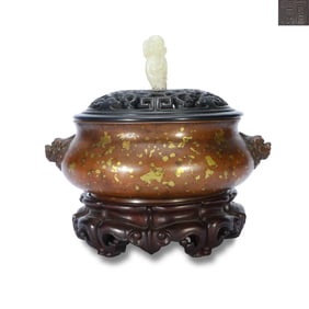 Ming Xuande period copper censer with gold-sprinkled patterns and two lion-shaped ears