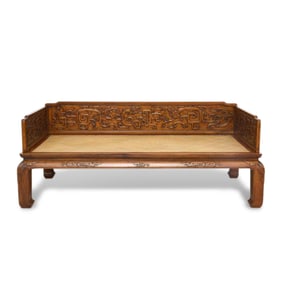 Qing Dynasty Huanghuali couch with carved dragon motifs and mat surface