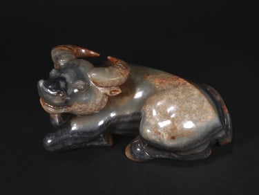 A JADE OX ORNAMENT FROM THE MING DYNASTY