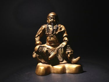 A GILDED BRONZE STATUE OF GUAN YU FROM THE QING DYNASTY