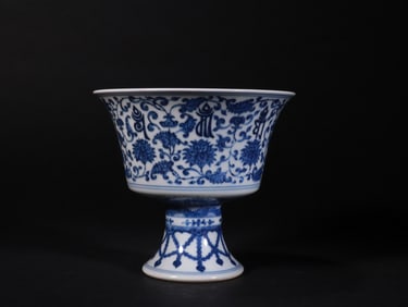 A QING DYNASTY BLUE AND WHITE SANSKRIT HIGH-FOOTED CUP