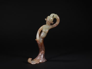 A JADE DANCER FIGURINE FROM THE HAN DYNASTY
