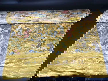 A PIECE OF FABRIC WITH FIGURE PATTERNS FROM THE MING DYNASTY