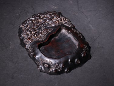A PURPLE SANDALWOOD INKSTONE FROM THE QING DYNASTY