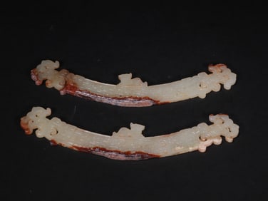 A PAIR OF JADE PENDANTS FROM THE HAN DYNASTY