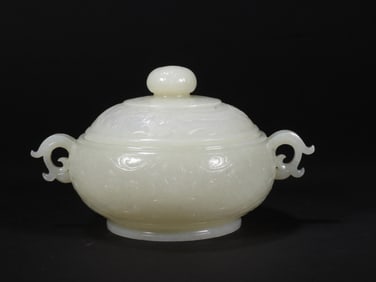 A WHITE JADE INCENSE BURNER WITH ANIMAL AND DRAGON PATTERNS FROM THE QING DYNASTY