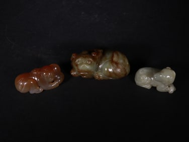 JADE PIECES IN THE SHAPE OF BEASTS FROM THE MING DYNASTY