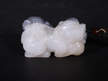 A WHITE JADE LION FROM THE QING DYNASTY