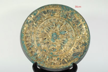 TANG DYNASTY GILDED SEA MONSTER AND GRAPE MIRROR