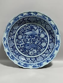 YUAN DYNASTY BLUE AND WHITE PLATE WITH KIRIN AND PHOENIX PATTERNS