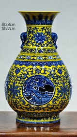 QING DYNASTY YELLOW GLAZE BLUE AND WHITE LOTUS REVOLVING VASE