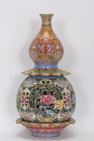 QING DYNASTY ENAMEL PAINTED GOLD GROUND CARVED ROTATING GOURD BOTTLE