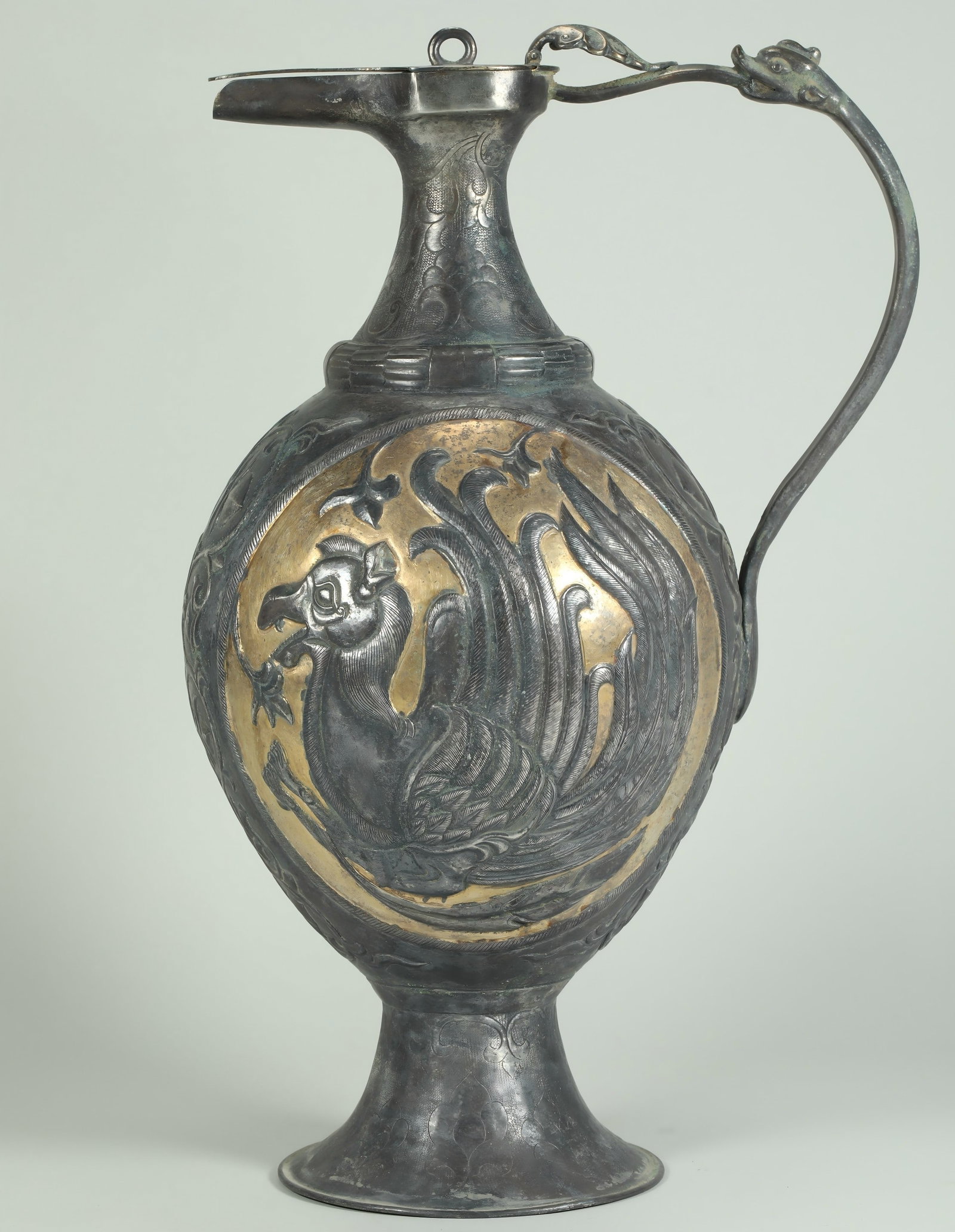 TANG DYNASTY SILVER GILDED PERSIAN POT: Name TANG DYNASTY SILVER GILDED PERSIAN POT Dimensions H:33CM L:22CM Condition Additional photographs and Condition reports are provided by request as a courtesy to our clients, as such