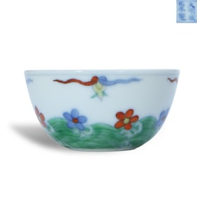 Ming Chenghua period a Doucai cup with the pattern of falling flowers and flowing water