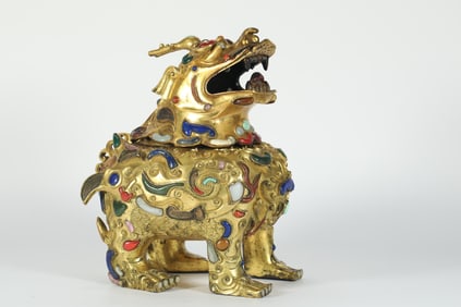A QING DYNASTY INLAID COPPER GILT AUSPICIOUS BEAST INCENSE BURNER
