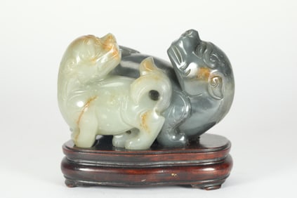 QING DYNASTY HETIAN JADE BLUE AND WHITE LION