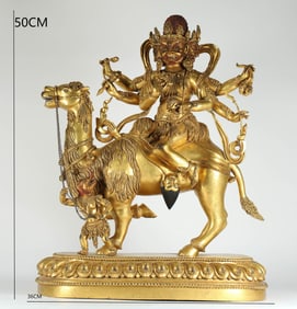 A MING DYNASTY GILDED BRONZE STATUE OF MAHAKALA WITH SIX ARMS
