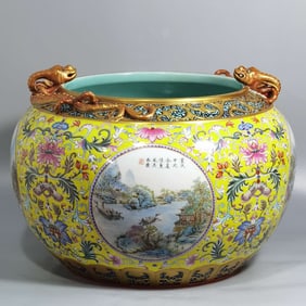 QING DYNASTY YELLOW GROUND FAMILLE ROSE LANDSCAPE AND FIGURE COILED DRAGON JAR