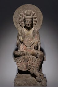 A LARGE WEI DYNASTY GILDED AND PAINTED BUDDHA STATUE