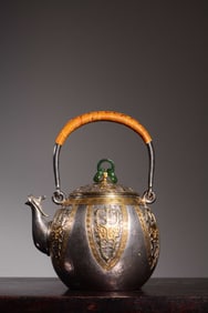 SIX-GILT SILVER EWER WITH TAOTIE DESIGN