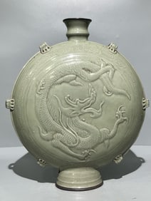 FIVE DYNASTIES YUE WARE CELADON FLAT POT WITH RELIEF DRAGON PATTERN