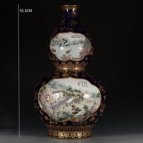QING DYNASTY FAMILLE ROSE BLUE-AND-GILT GOURD-SHAPED VASE
