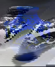 YUAN DYNASTY BLUE GLAZED JAR WITH WHITE DRAGON DESIGN