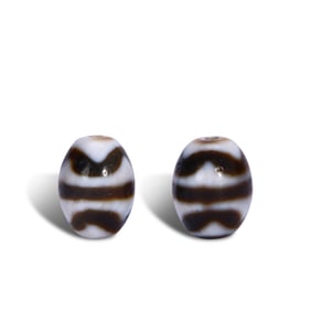 Ming Dynasty or earlier: A set of tiger-tooth dzi beads