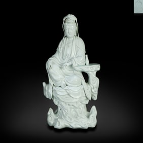 Ming Dynasty Dehua kiln white-glazed Guanyin statue holding a scroll, made by He Chaozong