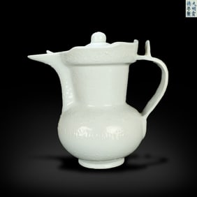 Ming Dynasty Xuande period, Green jade monk's cap ewer with incised Tibetan auspicious verses and