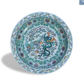 Qing Qianlong period a Large doucai plate with a flared rim and the pattern of dragons and phoenixes