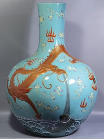 QING DYNASTY CARVED PORCELAIN FAMILLE ROSE FISH AND DRAGON TRANSFORMATION VASE