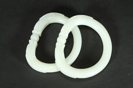 A PAIR OF HETIAN JADE DRAGON BRACELETS FROM THE QING DYNASTY