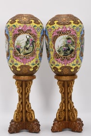 A PAIR OF QING DYNASTY ENAMEL CANDLESTICKS