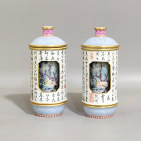 A PAIR OF QING DYNASTY ENAMEL LANDSCAPE AND POETRY REVOLVING SNUFF BOTTLES