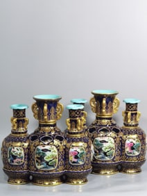 A PAIR OF OPENWORK REVOLVING VASES FROM THE QING DYNASTY