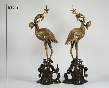 A PAIR OF GILDED CRANE CANDLESTICKS FROM THE QING DYNASTY