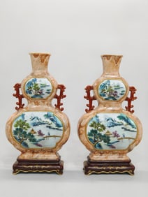 A PAIR OF QING DYNASTY FAMILLE ROSE WALL VASES