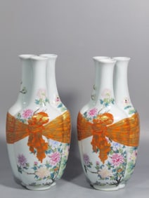 A PAIR OF QING DYNASTY FAMILLE ROSE THREE-HOLE VASES