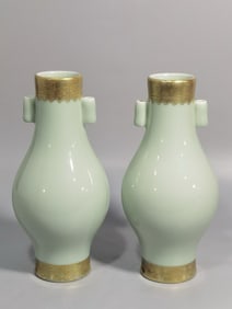 A PAIR OF QING DYNASTY CELADON OLIVE-SHAPED VASES WITH GOLD DECORATION