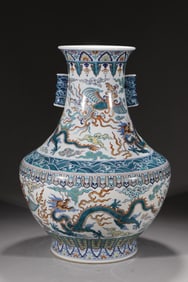 A QING DYNASTY DOUCAI (ENAMEL OVERGLAZE) DRAGON AND PHOENIX AUSPICIOUS VASE WITH PIERCED EARS