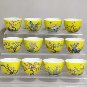 A SET OF TWELVE FLOWER GODDESS CUPS IN LEMON YELLOW GLAZE FROM THE QING DYNASTY