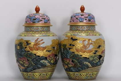 A PAIR OF QING DYNASTY ENAMEL-PAINTED OPENWORK COVERED JARS