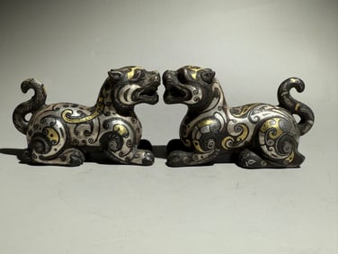 A PAIR OF WARRING STATES PERIOD GOLD AND SILVER INLAID BEASTS