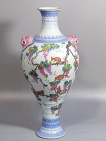 QING DYNASTY FAMILLE ROSE GRAPE AND SQUIRREL VASE