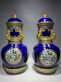 A PAIR OF QING DYNASTY BLUE-GLAZED REVOLVING VASES